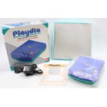 A Bandai Playdia Quick Interactive Gaming System, housed in the original card box, appears
