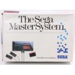 A Sega Master System interactive video entertainment system boxed console, comprising of power