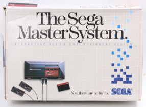 A Sega Master System interactive video entertainment system boxed console, comprising of power