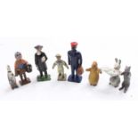 Collection of mixed figures to include Britains Vicar, lead baby in blanket figure, Luntoy Rag,