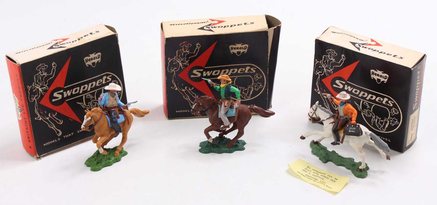 A Herald Swoppets boxed Cowboy figure group to include No. 630 Cowboy Sherrif mounted, No. H631