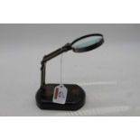 A reproduction adjustable table-top magnifying glass, h.18cm