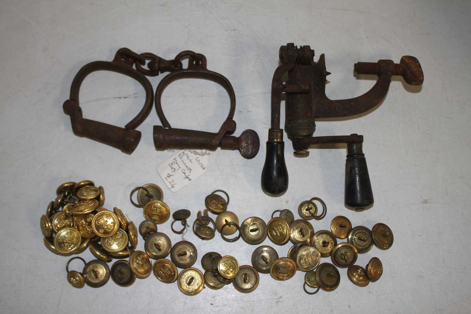 A collection of miscellaneous items, to include a cast iron cartridge loader, pair fo iron