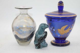 A Poole Pottery model of an otter, length 12cm, together with a glass vase and a glass sweet jar (