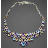 A modern silver semi-precious set necklet, to include amethyst, topaz and garnets