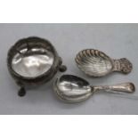 A George III silver open salt of squat circular form on cast feet, together with a silver caddy
