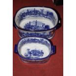Two graduated blue & white transfer decorated pottery foot baths, largest width 48cm