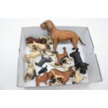 A small collection of figures of dogs, various breeds to include painted metal and carved wooden