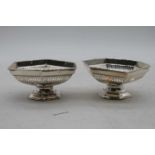 A pair of George V silver bonbon dishes each of pierced hexagonal form on further hexagonal foot,