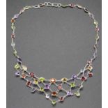 A modern silver and multi-stone set necklet, to include amethyst, garnet, peridot and citrine