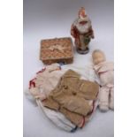A vintage cloth doll and various dolls clothing