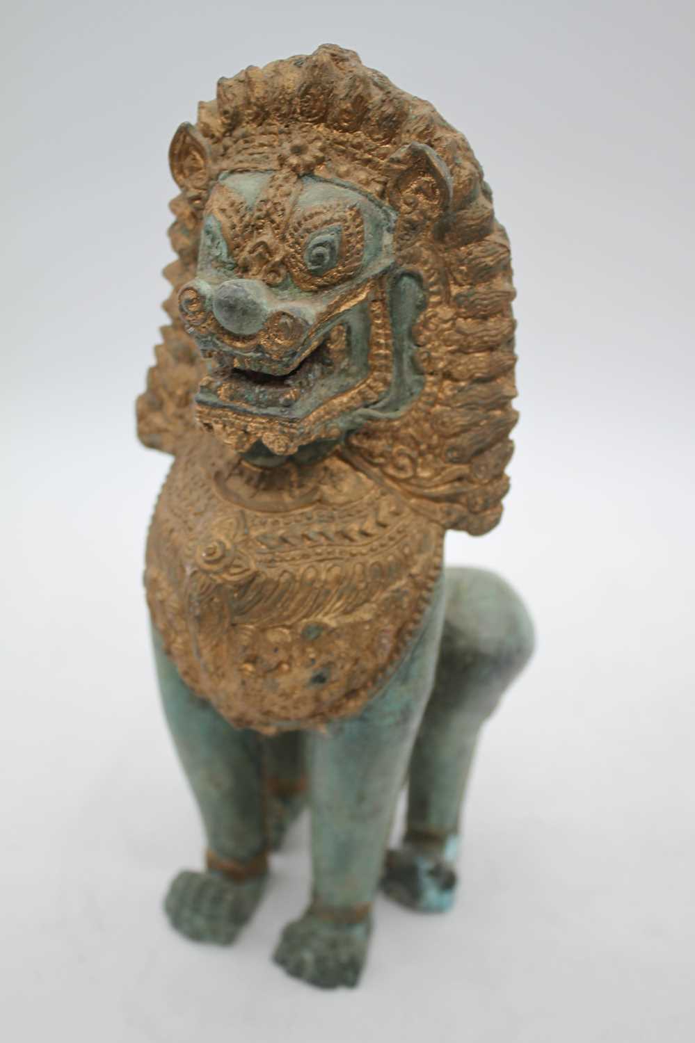 An eastern verdigris and gilt metal figure of a deity, shown kneeling, height 32cm; together with - Image 2 of 4