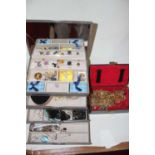 A leather clad jewellery box and contents, being mainly gold plated chains and bracelets; together