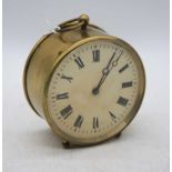 A brass drum clock, the dial showing Roman numerals, h.10.5cm