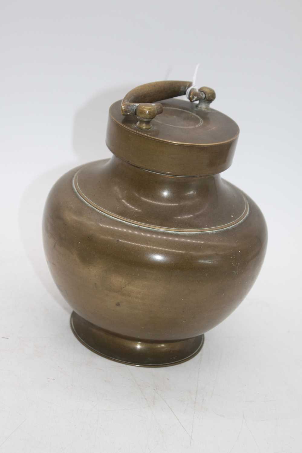 An Indian brass holy water vessel, of baluster form, height 21cm including handle - Image 2 of 3