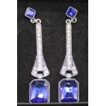 A pair of Art Deco style faux blue and white sapphire set ear pendants, 8cm