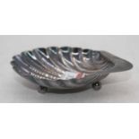 A George V silver shell shaped butter dish on ball feet, 1.8oz