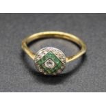 An Art Deco 18ct gold, emerald and diamond set dress ring, arranged as a centre old round cut
