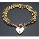 A 9ct gold curblink double bracelet, with heart shaped padlock clasp and safety chain, 23.3gBracelet