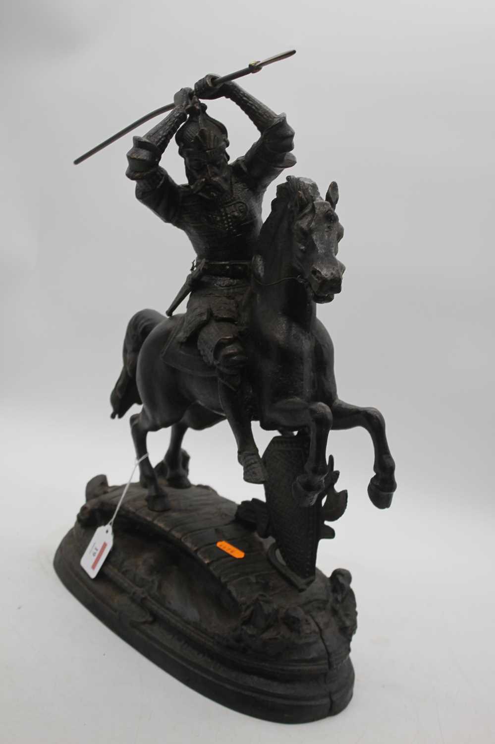 A reproduction cast iron figure of a soldier on horseback, shown carrying a spear, height 51cm - Image 3 of 4