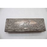 An Edwardian oak glove box of hinged rectangular form, the silver clad lid embossed with gundogs