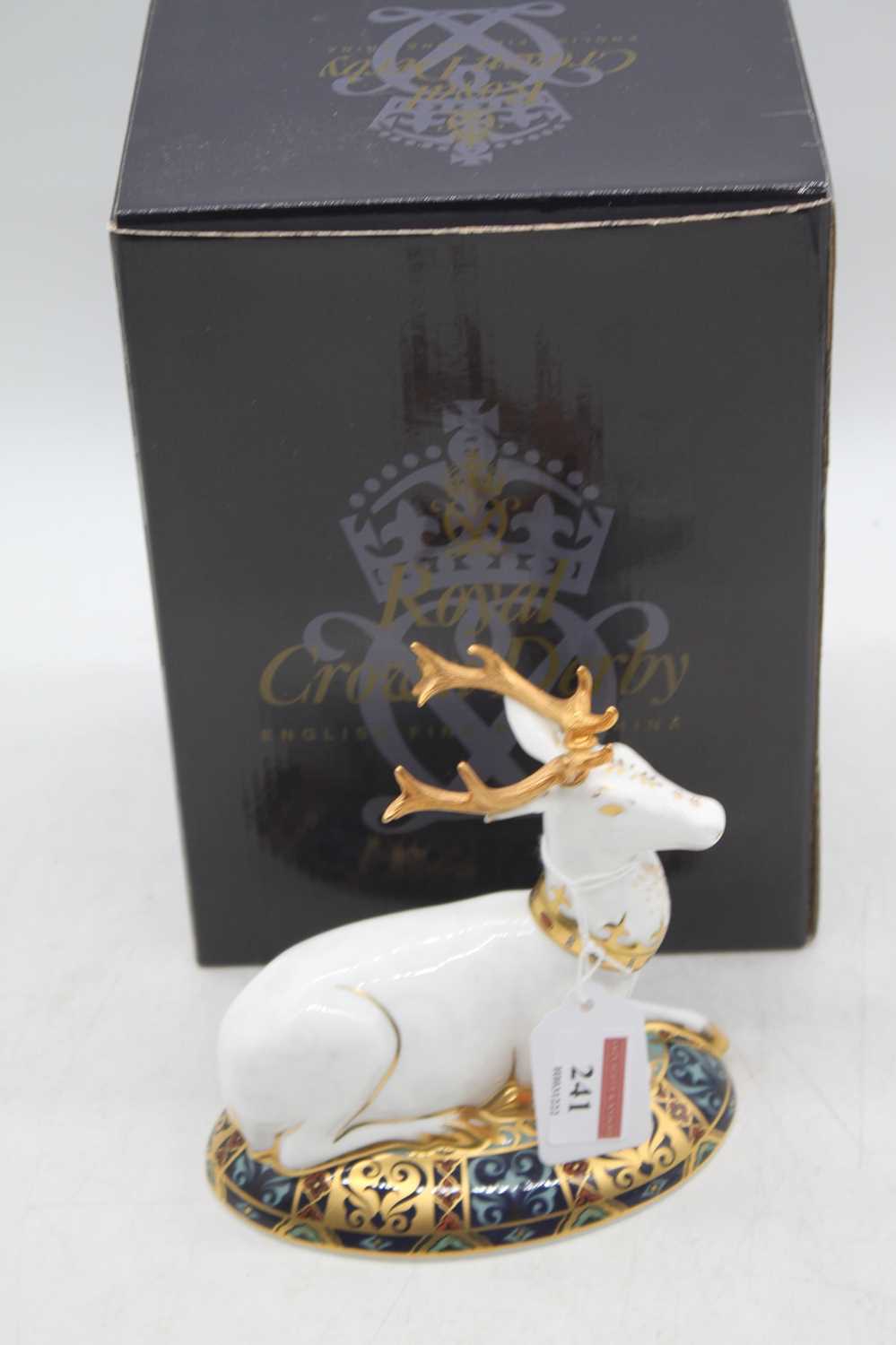A Royal Crown Derby model of a white hart, h.14cm, boxedIn good order.Gold stopper.