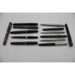 A collection of vintage fountain and ballpoint pens, to include several Parker examples and lesser-
