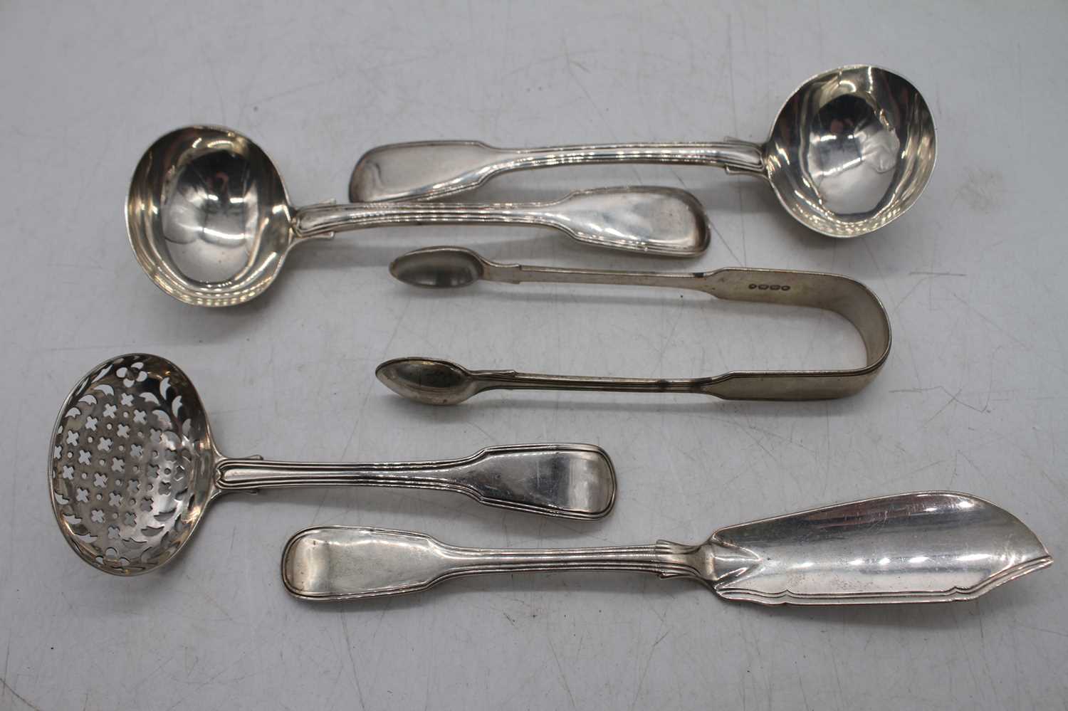 A collection of 19th century silver flat wares in the Fiddle & Thread pattern to include a pair of