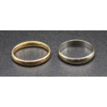 A 9ct yellow gold wedding band; together with one other 9ct white gold wedding band, gross weight