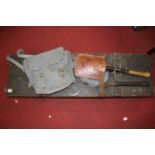 A WWI period pine box containing a WWII Air Ministry escape axe, a WWII trench shovel, with