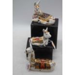 A Royal Crown Derby model of a llama, h.13cm; together with another of a donkey and a donkey foal (2