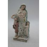 An early 19th century pearlware figure of Charity, h.19cmRestored