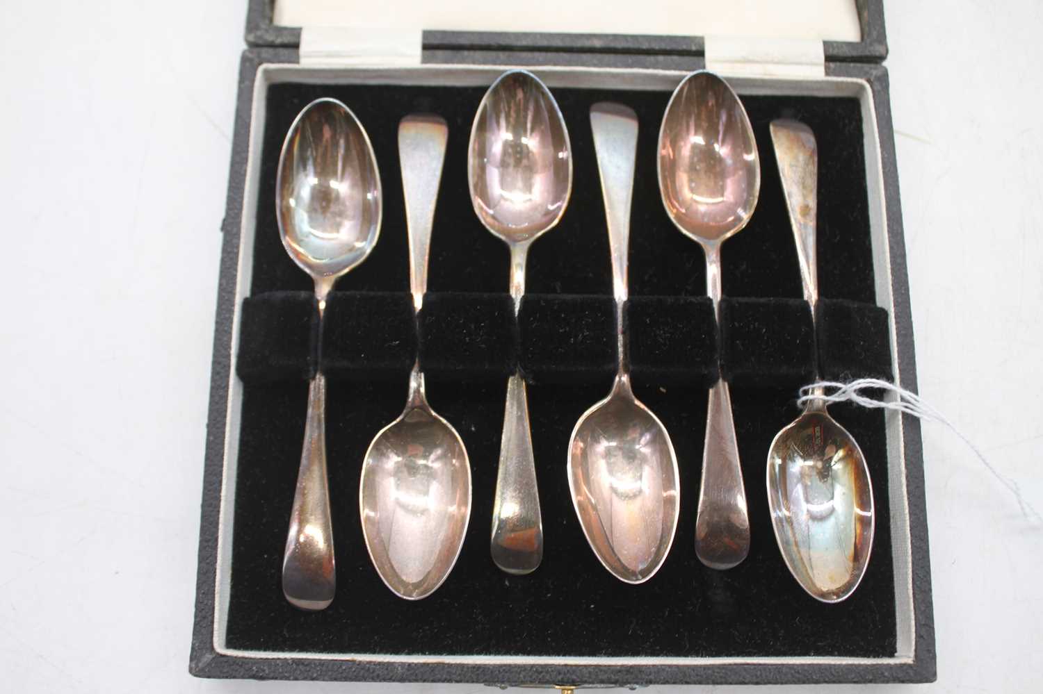 A set of six George V silver tea spoons in fitted leather case, gilt tooled to the lid H&LB 1872-