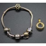 A Pandora bracelet with charms, safety chain, in box; together with another Pandora gilt metal