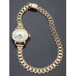 A lady's Tudor Royal 9ct gold cased manual wind wristwatch, case dia.20mm, on 9ct gold bracelet,