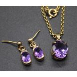 A 9ct gold belcher neck chain, supporting an amethyst set gold mounted pendant; together with a pair