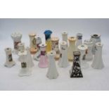 A collection of ceramic hat-pin holders, to include crested examples