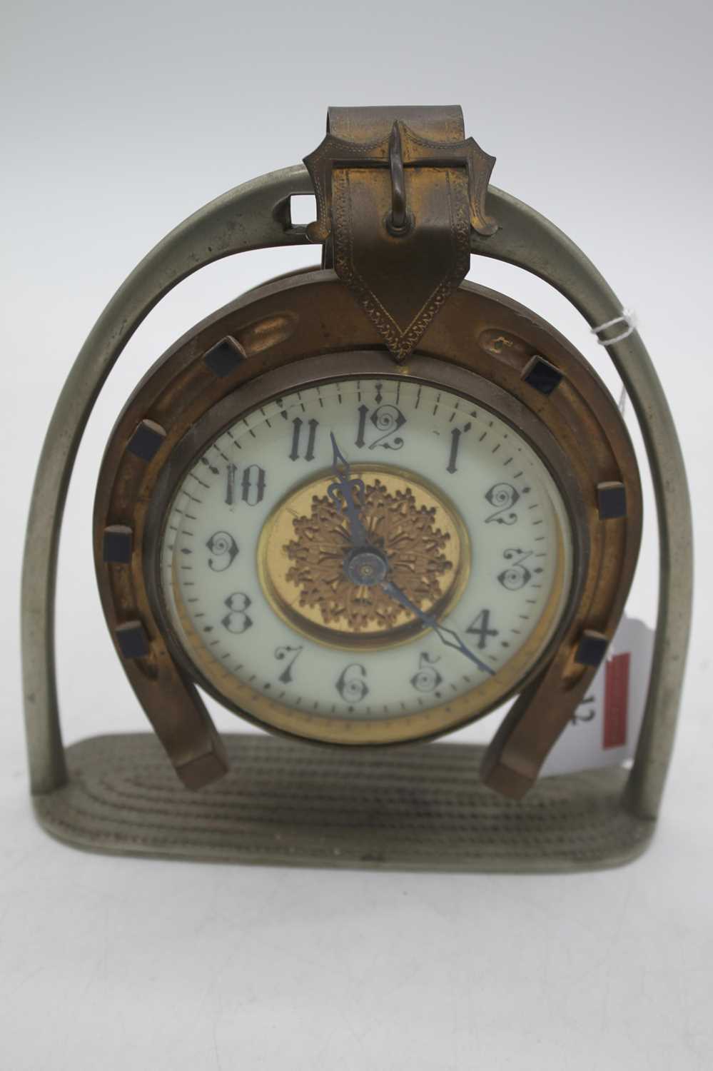 An early 20th century brass horseshoe clock, the enamel chapter ring showing Arabic numerals, height