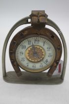 An early 20th century brass horseshoe clock, the enamel chapter ring showing Arabic numerals, height