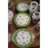 A Coalport twelve place dessert service, floral decorated within an apple green borderGlaze is badly