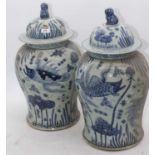 A pair of Chinese blue & white glazed temple jars, height 48cm