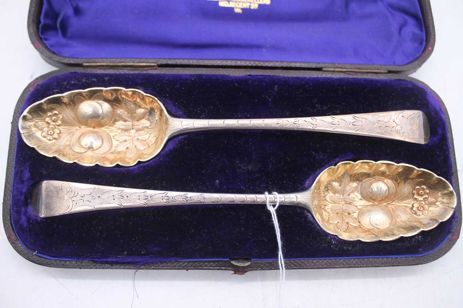 A pair of 19th century silver berry spoons, having embossed gilt washed bowls with bright cut - Image 2 of 4
