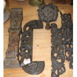 A collection of antique wooden carvings to include a carved oak furniture mount, decorated with