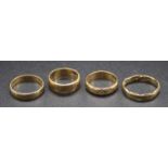 Four various 9ct gold wedding bands, each with carved detail, 9.9g