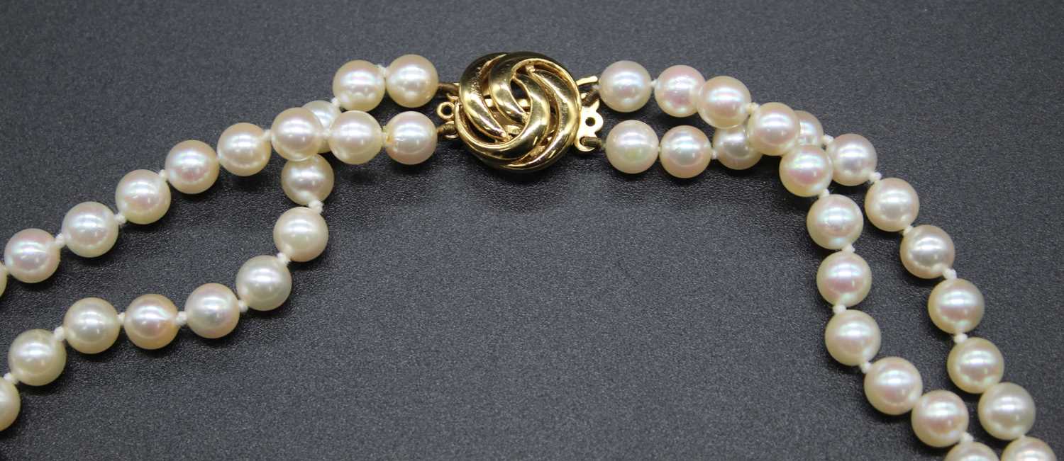 A cultured pearl double string knotted choker, on 9ct gold clasp, 38cm - Image 2 of 2