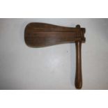 A vintage oak and elm handled football rattle, 35cm