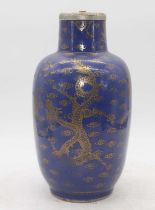 A Chinese blue glazed stoneware vase, gilt decorated with four clawed dragons, later converted