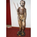 A carved wood figure of a man, having adjustable arms, height 80cm