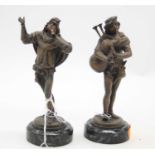 A pair of bronzed figures of musicians, each mounted upon a polished hardstone plinth, h.15cm