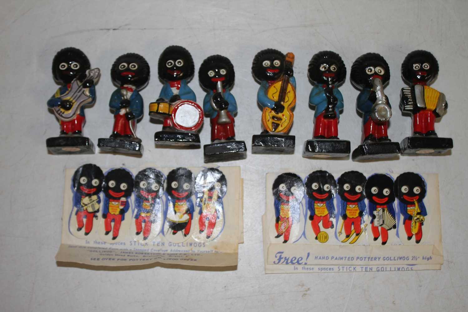 A collection of Robertson's jam pottery advertising figures, the largest h.6.5cm